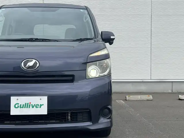 トヨタ ヴォクシー X Lエディション 秋田県 2007(平19)年 17.9万km ダークバイオレットマイカメタリック 社外ナビ/４WD/両側パワスラ/社外アルミ/スマートキー/アイドリングストップ/プッシュスタート/フリップダウンモニター/センターデフロック/MTモード付AT/ETC/純正フロアマット/純正ドアバイザー/オートエアコン/パワーステアリング/パワーウィンドウ/電動格納ウィンカーミラー/保証書/取扱説明書/記録簿