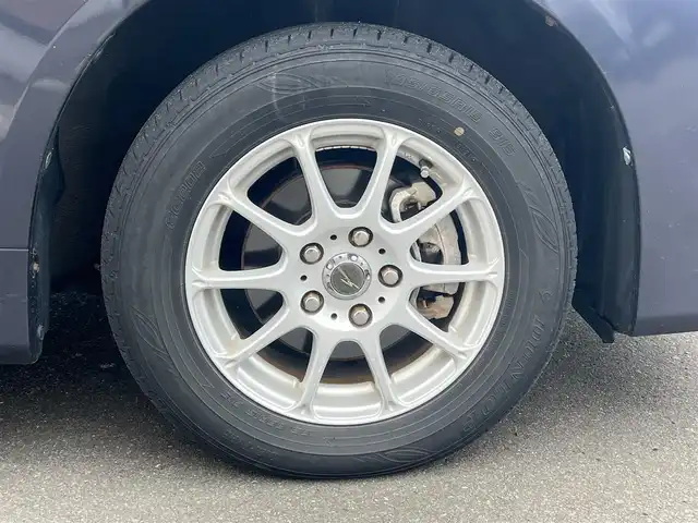 トヨタ ヴォクシー X Lエディション 秋田県 2007(平19)年 17.9万km ダークバイオレットマイカメタリック 社外ナビ/４WD/両側パワスラ/社外アルミ/スマートキー/アイドリングストップ/プッシュスタート/フリップダウンモニター/センターデフロック/MTモード付AT/ETC/純正フロアマット/純正ドアバイザー/オートエアコン/パワーステアリング/パワーウィンドウ/電動格納ウィンカーミラー/保証書/取扱説明書/記録簿