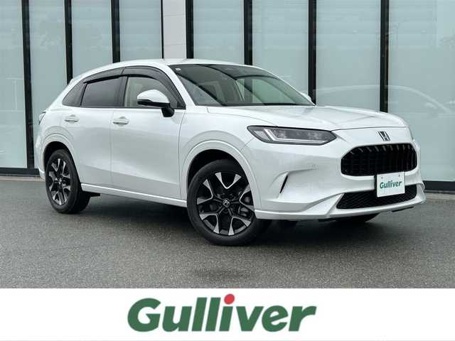 ホンダ ＺＲ－Ｖ ハイブリッド e:HEV Z 大阪府 2023(令5)年 0.8万km プラチナホワイトパール 純正９インチナビ/   フルセグTV/Bluetooth/USB/全方位モニター/衝突軽減ブレーキ/横滑り防止装置/コーナーセンサー/レザーシート/前席シートヒーター/レーダークルーズコントロール/レーンキープアシスト/パドルシフト/電動リアゲート/パワーシート（運転席のみメモリー付き）/ワイヤレス充電/ステアリングヒーター/ダウンヒルアシストコントロール/前後ドライブレコーダー/オートマチックハイビーム/純正18インチアルミホイール/純正フロアマット/プッシュスタート/スマートキー/ＥＴＣ/ＬＥＤ/禁煙車