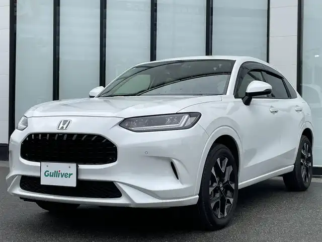 ホンダ ＺＲ－Ｖ ハイブリッド e:HEV Z 大阪府 2023(令5)年 0.8万km プラチナホワイトパール 純正９インチナビ/   フルセグTV/Bluetooth/USB/全方位モニター/衝突軽減ブレーキ/横滑り防止装置/コーナーセンサー/レザーシート/前席シートヒーター/レーダークルーズコントロール/レーンキープアシスト/パドルシフト/電動リアゲート/パワーシート（運転席のみメモリー付き）/ワイヤレス充電/ステアリングヒーター/ダウンヒルアシストコントロール/前後ドライブレコーダー/オートマチックハイビーム/純正18インチアルミホイール/純正フロアマット/プッシュスタート/スマートキー/ＥＴＣ/ＬＥＤ/禁煙車