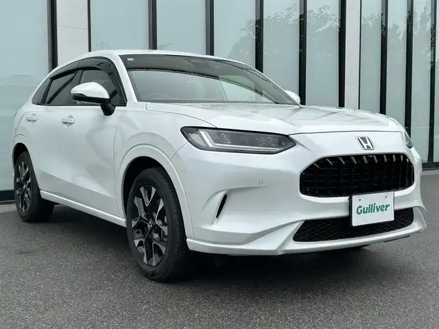 ホンダ ＺＲ－Ｖ ハイブリッド e:HEV Z 大阪府 2023(令5)年 0.8万km プラチナホワイトパール 純正９インチナビ/   フルセグTV/Bluetooth/USB/全方位モニター/衝突軽減ブレーキ/横滑り防止装置/コーナーセンサー/レザーシート/前席シートヒーター/レーダークルーズコントロール/レーンキープアシスト/パドルシフト/電動リアゲート/パワーシート（運転席のみメモリー付き）/ワイヤレス充電/ステアリングヒーター/ダウンヒルアシストコントロール/前後ドライブレコーダー/オートマチックハイビーム/純正18インチアルミホイール/純正フロアマット/プッシュスタート/スマートキー/ＥＴＣ/ＬＥＤ/禁煙車