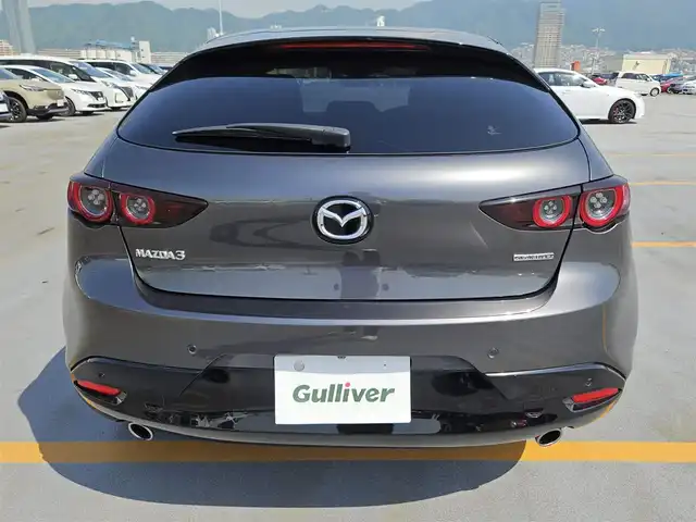 マツダ マツダ３ファストバック XD バーガンディセレクション 島根県 2019(令1)年 7.4万km マシーングレープレミアムM 純正8.8型ナビ/　(AM/FM/CD/DVD)/360度ビューモニター/ビルトインETC/全車速追従機能付レーダークルーズコントロール/パーキングセンサー/i-ACTIVSENSE/・スマートブレーキサポート/・AT誤発進抑制制御/・クルージングトラフィックサポート/・車線逸脱警報システム/・レーンキープアシスト/・前後接近車両検知/・ブラインドスポットモニタリング/・交通標識認識システム/アクティブドライビングディスプレイ/ターボ/アダプティブLEDヘッドランプ/本革巻きステアリング/ステアリングヒーター/パドルシフト/レッドパーフォレーション革シート/前席シートヒーター/運転席ドライビングポジション機能/純正18インチアルミホイール/アドバンストキーレスエントリーシステム/BOSEサウンドシステム/禁煙車