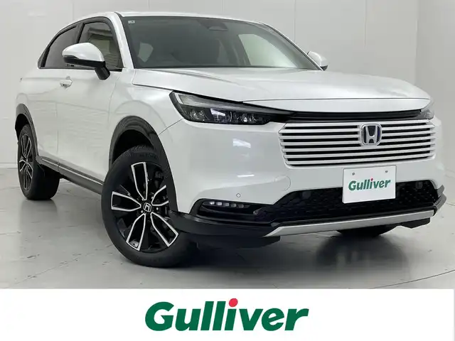 ホンダ ヴェゼル ハイブリッド e:HEV Z 茨城県 2025(令7)年 0.1千km プラチナホワイトパール 登録済未使用車/MOP純正9型Honda CONNECTディスプレー/バックカメラ/フルセグ/ワイヤレス充電/衝突被害軽減ブレーキ/車線逸脱抑制装置/レーダークルーズコントロール/オートマチックハイビーム/クリアランスソナー/BSI/ハンズフリーアクセスパワーテールゲート/ETC2.0/ハーフレザー/シートヒーター/ステアリングヒーター/純正18インチAW/LEDヘッドライト/スマートキー