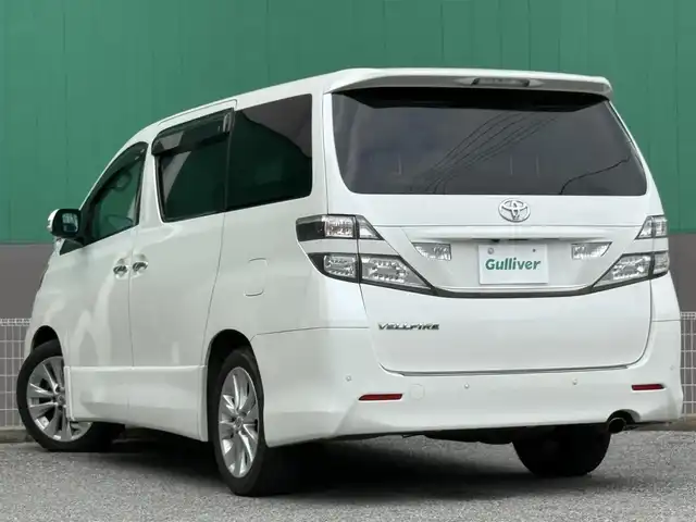 トヨタ ヴェルファイア 2．4Z プラチナセレクション 千葉県 2010(平22)年 10.7万km ホワイトパールクリスタルシャイン 社外SDナビ（AM/FM/CD/DVD/Bluetooth）/フルセグTV/バックカメラ/ETC/ALPINE製フリップダウンモニター/両側パワースライドドア/MTモード付AT/オットマン/フォグランプ/HIDヘッドライト/パワーバックドア/純正フロアマット/純正アルミホイール/スマートキー