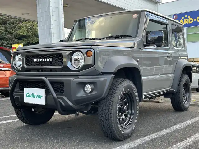 スズキ ジムニー シエラ JL 長崎県 2022(令4)年 1.7万km ミディアムグレー ワンオーナー/プッシュスタート/社外ディスプレイオーディオ(FM/AM/CD/DVD/BT)/ETC/5速マニュアル/パートタイム4WD/バックカメラ/背面タイヤ/純正フロアマット/DN席シートヒーター/ベンチシート/電動格納ミラー/ヘッドライトレベライザ/オートライト/ABS/ESP/トラクションコントロール/ヒルディセントコントロール/イモビライザー/スマートキー/スペアキー/取扱説明書/保証書