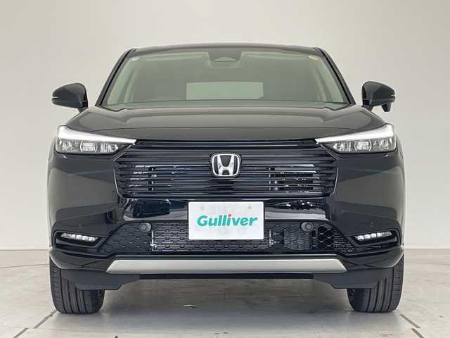 ホンダ ヴェゼル ハイブリッド e:HEV Z 愛知県 2025(令7)年 0.1千km クリスタルブラックパール 登録済未使用車/純正9型ディスプレイオーディオナビ/レーダークルーズコントロール/シートヒーター/バックカメラ/電動リアゲート/コーナーセンサー/純正アルミホイール/ETC2.0/ブラインドスポットモニター/LEDヘッドライト/パドルシフト/ステアリングヒーター/オートマチックハイビーム/ワイヤレス充電機/衝突軽減システム/フルセグ/Bluetooth/ステアリングスイッチ/スマートキー/プッシュスタート