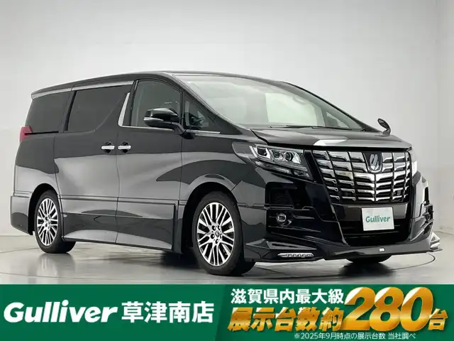トヨタ アルファード S Cパッケージ 滋賀県 2018(平30)年 0.9万km ブラック 純正10型ナビ/（CD/DVD/フルセグTV/SD/BT）/レーダークルーズコントロール/純正フリップダウンモニター/TRDエアロ（F/S/R）/バックカメラ/ビルトインETC2.0/ドライブレコーダー/両側パワースライドドア/クリアランスソナー/パワーバックドア/ハーフレザーシート/パワーシート/ステアリングヒーター/電動パーキングブレーキ/オートブレーキホールド/社外フロアマット/LEDヘッドライト/純正18インチAW
