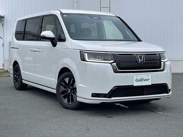ホンダ ステップワゴン スパーダ eHEV 三重県 2025(令7)年 0.1万km未満 プラチナホワイトパール プッシュスタート/横滑り防止/両側パワースライドドア/電動リヤゲート/オートライト/オートマチックハイビーム/リアサンシェード/電動格納ミラー/レーダークルーズコントロール/パドルシフト/レーンキープアシスト/衝突軽減ブレーキ/ブラインドスポットモニター/コーナーセンサー/純正SDナビ(AM/FM/CD/DVD/TV/BT)/シートヒーター(D+N席)/ステアリングスイッチ/革巻きステアリング/電動パーキング/ウォークスルー/USB入力端子1ヶ所/タイプC入力端子5か所/LEDヘッドライト/スペアキー/ワンオーナー/取扱説明書/保証書/禁煙車
