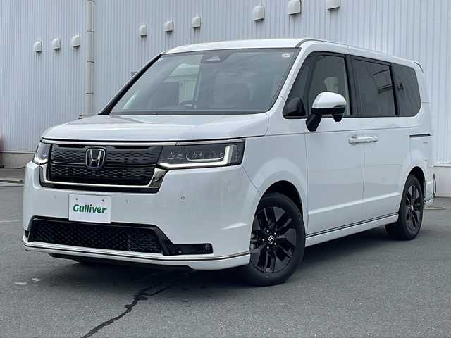 ホンダ ステップワゴン スパーダ eHEV 三重県 2025(令7)年 0.1万km未満 プラチナホワイトパール プッシュスタート/横滑り防止/両側パワースライドドア/電動リヤゲート/オートライト/オートマチックハイビーム/リアサンシェード/電動格納ミラー/レーダークルーズコントロール/パドルシフト/レーンキープアシスト/衝突軽減ブレーキ/ブラインドスポットモニター/コーナーセンサー/純正SDナビ(AM/FM/CD/DVD/TV/BT)/シートヒーター(D+N席)/ステアリングスイッチ/革巻きステアリング/電動パーキング/ウォークスルー/USB入力端子1ヶ所/タイプC入力端子5か所/LEDヘッドライト/スペアキー/ワンオーナー/取扱説明書/保証書/禁煙車