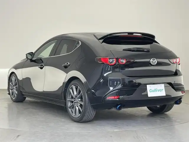 マツダ マツダ３ファストバック 20S バーガンディセレクション 愛知県 2020(令2)年 1.5万km ジェットブラックマイカ 純正ナビ　フルセグＴＶ　ＨＤＭＩ　ＤＶＤ　ＢＯＳＥサウンド　全方位カメラ　赤革　シートヒーター　衝突軽減　追従クルコン　コーナーセンサー　ＢＳＭ　ＬＥＤオートライト　ＥＴＣ　ハンドルヒーター　禁煙車