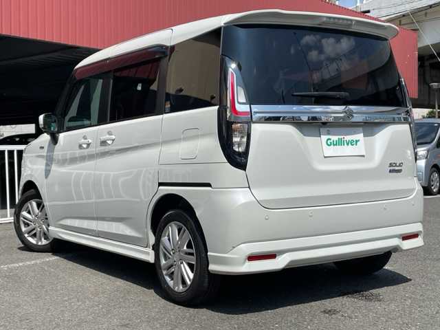 スズキ ソリオ HV MZ 神奈川県 2021(令3)年 2万km ピュアホワイトP 純正メモリーナビ/・DTV/CD/DVD/ラジオ/BT/USB/ヘッドアップディスプレイ/スズキセーフティサポート/・全方位カメラ/・デュアルカメラブレーキサポート/・前後誤発進抑制機能/・車線逸脱警報/・ふらつき警報/・先行車発進お知らせ機能/・ハイビームアシスト/・アダプティブクルーズコントロール/・標識認識機能/・リヤパーキングセンサー/前席シートヒーター/D席シートリフター/前席後部パーソナルテーブル/両側パワースライドドア/ビルトインETC/革巻きステアリング/純正15インチAW/純正LEDヘッドライト/フォグランプ/プッシュEgスタート/ストップ/スマートキー×2/ターンランプ付電動格納ドアミラー/ドアバイザー/社外フロアマット/取扱説明書/ナビ取扱説明書/新車時保証書