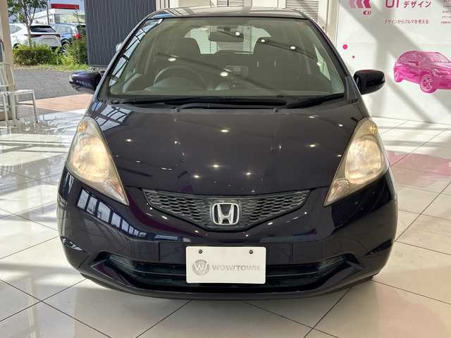 ホンダ フィット G 埼玉県 2009(平21)年 18.2万km プレミアムディープバイオレットパール ドアミラーウインカー/電動格納式リモコンカラードドアミラー/高熱線吸収/UVカット機能付プライバシーガラス/運転席ハイトアジャスター/セキュリティアラーム/アレルフリー高性能脱臭フィルター/AM/FMチューナー付きCDプレイヤー/純正ナビ/ETC