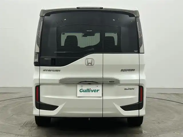 ホンダ ステップワゴン スパーダ eHEV G EXホンダS 岡山県 2021(令3)年 6.3万km プラチナホワイトパール 純正9インチナビ/【Bluetooth/フルセグTV/CD/DVD/USB接続】/全方位カメラ/両側パワースライドドア/前席シートヒーター/ハーフレザーシート/レーダークルーズコントロール/衝突軽減ブレーキシステム/ビルトインETC2.0/LEDヘッドライト/フォグランプ/社外ドライブレコーダー（前後）/オートブレーキホールド/純正16インチアルミホイール/純正フロアマット/新車保証書