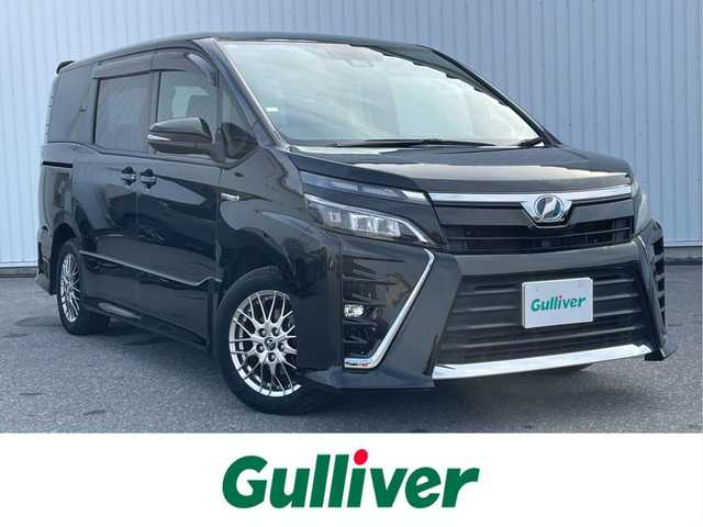 トヨタ ヴォクシー ハイブリッド ZS 滋賀県 2017(平29)年 6.9万km イナズマスパーキングブラックガラスフレーク ALPINE11インチナビ/・AM/FM/・CD/DVD/・SD/USB/HDMI/・Bluetooth/・フルセグTV/バックカメラ/ステアリングスイッチ/革巻きステアリング/クルーズコントロール/前方ドライブレコーダー/ETC/前席シートヒーター/USB充電/プリクラッシュセーフティ/レーンディパーチャーアラート/先行車発進告知/両側パワースライドドア/フロントワイパーデアイサー/オートヘッドライト/フォグランプ/オートハイビーム/オートリトラミラー/スマートキー