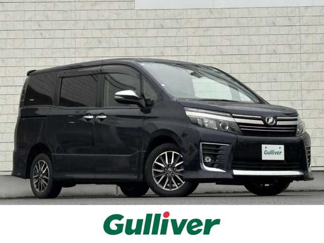 トヨタ ヴォクシー ZS 煌Ⅱ 岩手県 2016(平28)年 7.4万km ブラッキッシュアゲハガラスフレーク 禁煙車/4WD/ALPINEフリップダウンモニター/両側パワースライドドア/社外ナビ/→フルセグTV/Bluetooth/CD/DVD/バックカメラ/デジタルインナーミラー/ステアリングスイッチ/セーフティセンス/レーンキープアシスト/衝突軽減システム/横滑り防止装置/オートライト/オートハイビーム/LEDヘッドライト/LEDフォグライト/〇プッシュスタート/〇電動格納ミラー/〇ウィンカーミラー/〇ドアバイザー/〇フロアマット/〇シガーソケット/〇スマートキー/ETC