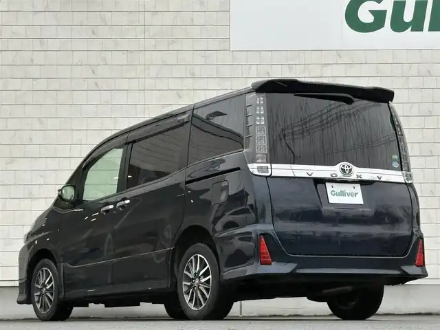 トヨタ ヴォクシー ZS 煌Ⅱ 岩手県 2016(平28)年 7.4万km ブラッキッシュアゲハガラスフレーク 禁煙車/4WD/ALPINEフリップダウンモニター/両側パワースライドドア/社外ナビ/→フルセグTV/Bluetooth/CD/DVD/バックカメラ/デジタルインナーミラー/ステアリングスイッチ/セーフティセンス/レーンキープアシスト/衝突軽減システム/横滑り防止装置/オートライト/オートハイビーム/LEDヘッドライト/LEDフォグライト/〇プッシュスタート/〇電動格納ミラー/〇ウィンカーミラー/〇ドアバイザー/〇フロアマット/〇シガーソケット/〇スマートキー/ETC