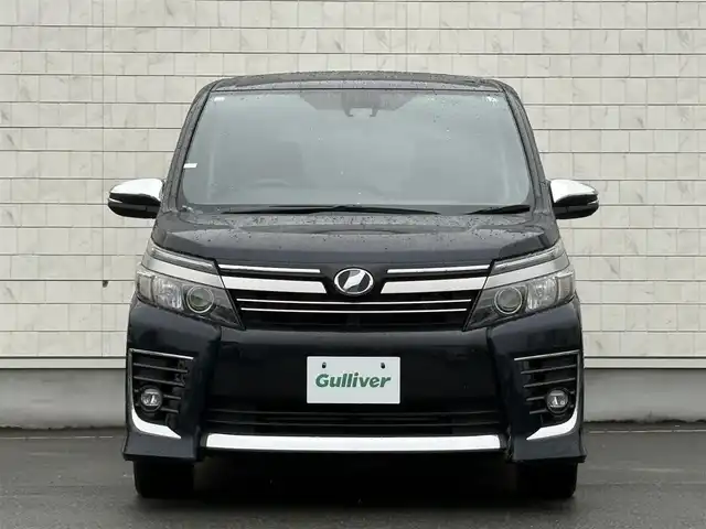 トヨタ ヴォクシー ZS 煌Ⅱ 岩手県 2016(平28)年 7.4万km ブラッキッシュアゲハガラスフレーク 禁煙車/4WD/ALPINEフリップダウンモニター/両側パワースライドドア/社外ナビ/→フルセグTV/Bluetooth/CD/DVD/バックカメラ/デジタルインナーミラー/ステアリングスイッチ/セーフティセンス/レーンキープアシスト/衝突軽減システム/横滑り防止装置/オートライト/オートハイビーム/LEDヘッドライト/LEDフォグライト/〇プッシュスタート/〇電動格納ミラー/〇ウィンカーミラー/〇ドアバイザー/〇フロアマット/〇シガーソケット/〇スマートキー/ETC