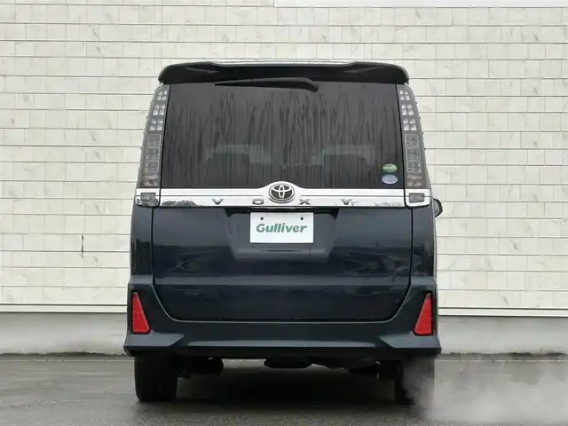 トヨタ ヴォクシー ZS 煌Ⅱ 岩手県 2016(平28)年 7.4万km ブラッキッシュアゲハガラスフレーク 禁煙車/4WD/ALPINEフリップダウンモニター/両側パワースライドドア/社外ナビ/→フルセグTV/Bluetooth/CD/DVD/バックカメラ/デジタルインナーミラー/ステアリングスイッチ/セーフティセンス/レーンキープアシスト/衝突軽減システム/横滑り防止装置/オートライト/オートハイビーム/LEDヘッドライト/LEDフォグライト/〇プッシュスタート/〇電動格納ミラー/〇ウィンカーミラー/〇ドアバイザー/〇フロアマット/〇シガーソケット/〇スマートキー/ETC