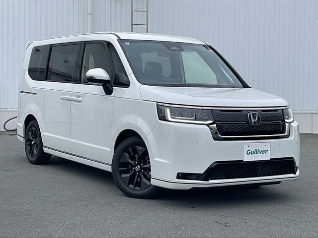 ホンダ ステップワゴン スパーダ eHEV 三重県 2025(令7)年 0.1万km未満 プラチナホワイトパール プッシュスタート/横滑り防止/電動リヤゲート/両側パワースライドドア/レーダークルーズコントロール/電動格納ミラー/パドルシフト/レーンキープアシスト/ステアリングスイッチ/革巻きステアリング/オートライト/オートマチックハイビーム/純正SDナビ(AM/FM/CD/DVD/TV/BT)/電動パーキング/シートヒーター(D+N席)/リアサンシェード/ブラインドスポットモニター/コーナーセンサー/USB入力端子1ヶ所/タイプC入力端子5か所/スペアキー/衝突軽減ブレーキ/バックカメラ/LEDヘッドライト/ウォークスルー/禁煙車/ワンオーナー/取扱説明書/保証書/ワンオーナー