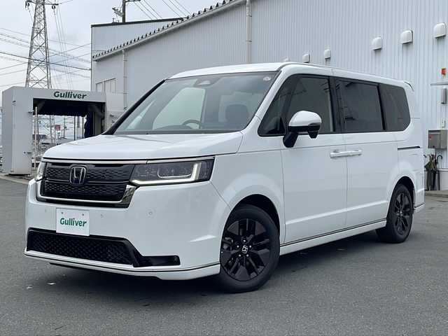 ホンダ ステップワゴン スパーダ eHEV 三重県 2025(令7)年 0.1万km未満 プラチナホワイトパール プッシュスタート/横滑り防止/電動リヤゲート/両側パワースライドドア/レーダークルーズコントロール/電動格納ミラー/パドルシフト/レーンキープアシスト/ステアリングスイッチ/革巻きステアリング/オートライト/オートマチックハイビーム/純正SDナビ(AM/FM/CD/DVD/TV/BT)/電動パーキング/シートヒーター(D+N席)/リアサンシェード/ブラインドスポットモニター/コーナーセンサー/USB入力端子1ヶ所/タイプC入力端子5か所/スペアキー/衝突軽減ブレーキ/バックカメラ/LEDヘッドライト/ウォークスルー/禁煙車/ワンオーナー/取扱説明書/保証書/ワンオーナー