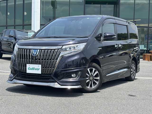 トヨタ エスクァイア ハイブリッド Gi プレミアムパッケージ 奈良県 2019(令1)年 7万km スパークリングブラックパールクリスタルシャイン モデリスタエアロ（Ｆ／Ｓ／Ｒ）　/９インチナビ　[NSZT-Y68T]/１２．１インチフリップダウン　/フルセグＴＶ　/ＥＴＣ　/専用黒革＋スウェードシート　/コンビステアリング　/トヨタセーフティセンス　/前席シートヒーター