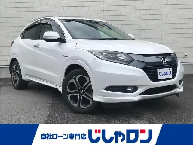 ホンダ ヴェゼル ハイブリッド Z 栃木県 2014(平26)年 9.9万km ホワイトオーキッドパール 株)IDOMが運営する【じしゃロン小山店】の自社ローン専用車両になります。こちらは現金またはオートローンご利用時の価格です。自社ローンご希望の方は別途その旨お申付け下さい//禁煙車/純正フルセグナビ/（CD/DVD/AM/FMラジオ）/(Bluetooth)/スマートキー/プッシュスタート/バックカメラ/ＥＴＣ/クルーズコントロール/シティブレーキアクティブシステム/ドライブレコーダー/パドルシフト/シートヒーター/ステアリングリモコン/電動格納ドアミラー/パワーウインドウ/自動防眩ミラー/オートライト