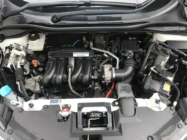 ホンダ ヴェゼル ハイブリッド Z 栃木県 2014(平26)年 9.9万km ホワイトオーキッドパール 株)IDOMが運営する【じしゃロン小山店】の自社ローン専用車両になります。こちらは現金またはオートローンご利用時の価格です。自社ローンご希望の方は別途その旨お申付け下さい//禁煙車/純正フルセグナビ/（CD/DVD/AM/FMラジオ）/(Bluetooth)/スマートキー/プッシュスタート/バックカメラ/ＥＴＣ/クルーズコントロール/シティブレーキアクティブシステム/ドライブレコーダー/パドルシフト/シートヒーター/ステアリングリモコン/電動格納ドアミラー/パワーウインドウ/自動防眩ミラー/オートライト