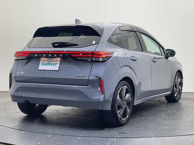 日産 オーラ G レザーエディション 愛媛県 2023(令5)年 1.4万km グレー ・純正メモリーナビ/・フルセグテレビ/Bluetooth/・アラウンドビューモニター/・BOSEサウンド/・レザーシート/・シートヒーター/・ステアリングヒーター/・衝突被害軽減ブレーキ/・レーンキープアシスト/・BSM/・プロパイロット/・前後コーナーセンサー/・LEDヘッドライト/・スマートキー/・ETC