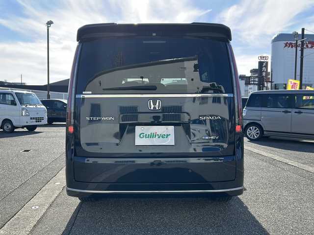 ホンダ ステップワゴン スパーダ eHEV 富山県 2022(令4)年 1.8万km ミッドナイトブルービームM ワンオーナー/スマートキー２本/衝突安全ブレーキ/メーカーオプションナビ/全周囲モニター/前後ドラレコ/シーケンシャルウィンカー/フルセグTV/Bluetooth/DVD/CD再生/ビルトインETC2.0/パドルシフト/純正16インチAW/前席シートヒーター/LEDヘッドライト/フォグランプ/ACC/ハーフレザーシート/純正フロアマット/ドアバイザー/ハンドルスイッチ/革巻きハンドル/Pバックドア/BSI/横滑り防止装置/プッシュスタート/電動パーキング/２列目オットマン/衝突軽減ブレーキ