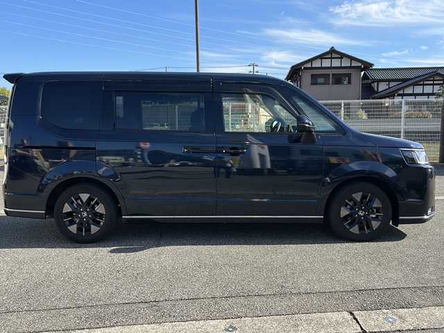 ホンダ ステップワゴン スパーダ eHEV 富山県 2022(令4)年 1.8万km ミッドナイトブルービームM ワンオーナー/スマートキー２本/衝突安全ブレーキ/メーカーオプションナビ/全周囲モニター/前後ドラレコ/シーケンシャルウィンカー/フルセグTV/Bluetooth/DVD/CD再生/ビルトインETC2.0/パドルシフト/純正16インチAW/前席シートヒーター/LEDヘッドライト/フォグランプ/ACC/ハーフレザーシート/純正フロアマット/ドアバイザー/ハンドルスイッチ/革巻きハンドル/Pバックドア/BSI/横滑り防止装置/プッシュスタート/電動パーキング/２列目オットマン/衝突軽減ブレーキ