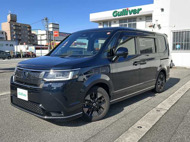 ホンダ ステップワゴン スパーダ eHEV 富山県 2022(令4)年 1.8万km ミッドナイトブルービームM ワンオーナー/スマートキー２本/衝突安全ブレーキ/メーカーオプションナビ/全周囲モニター/前後ドラレコ/シーケンシャルウィンカー/フルセグTV/Bluetooth/DVD/CD再生/ビルトインETC2.0/パドルシフト/純正16インチAW/前席シートヒーター/LEDヘッドライト/フォグランプ/ACC/ハーフレザーシート/純正フロアマット/ドアバイザー/ハンドルスイッチ/革巻きハンドル/Pバックドア/BSI/横滑り防止装置/プッシュスタート/電動パーキング/２列目オットマン/衝突軽減ブレーキ