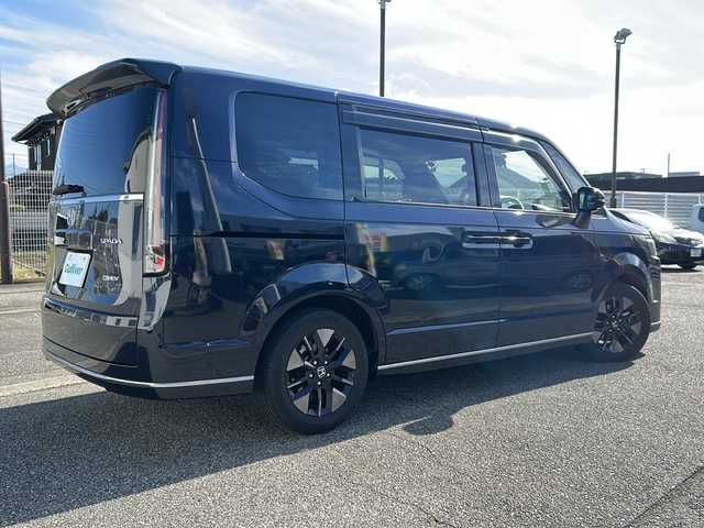 ホンダ ステップワゴン スパーダ eHEV 富山県 2022(令4)年 1.8万km ミッドナイトブルービームM ワンオーナー/スマートキー２本/衝突安全ブレーキ/メーカーオプションナビ/全周囲モニター/前後ドラレコ/シーケンシャルウィンカー/フルセグTV/Bluetooth/DVD/CD再生/ビルトインETC2.0/パドルシフト/純正16インチAW/前席シートヒーター/LEDヘッドライト/フォグランプ/ACC/ハーフレザーシート/純正フロアマット/ドアバイザー/ハンドルスイッチ/革巻きハンドル/Pバックドア/BSI/横滑り防止装置/プッシュスタート/電動パーキング/２列目オットマン/衝突軽減ブレーキ