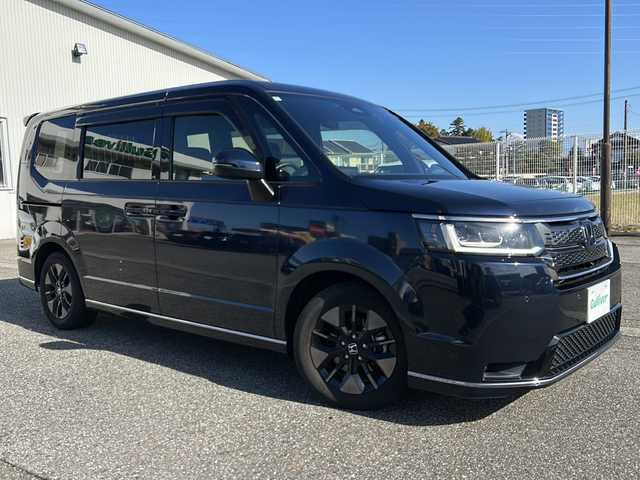 ホンダ ステップワゴン スパーダ eHEV 富山県 2022(令4)年 1.8万km ミッドナイトブルービームM ワンオーナー/スマートキー２本/衝突安全ブレーキ/メーカーオプションナビ/全周囲モニター/前後ドラレコ/シーケンシャルウィンカー/フルセグTV/Bluetooth/DVD/CD再生/ビルトインETC2.0/パドルシフト/純正16インチAW/前席シートヒーター/LEDヘッドライト/フォグランプ/ACC/ハーフレザーシート/純正フロアマット/ドアバイザー/ハンドルスイッチ/革巻きハンドル/Pバックドア/BSI/横滑り防止装置/プッシュスタート/電動パーキング/２列目オットマン/衝突軽減ブレーキ