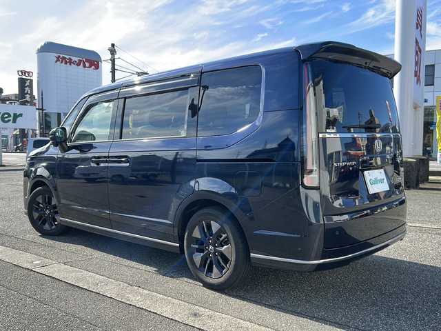 ホンダ ステップワゴン スパーダ eHEV 富山県 2022(令4)年 1.8万km ミッドナイトブルービームM ワンオーナー/スマートキー２本/衝突安全ブレーキ/メーカーオプションナビ/全周囲モニター/前後ドラレコ/シーケンシャルウィンカー/フルセグTV/Bluetooth/DVD/CD再生/ビルトインETC2.0/パドルシフト/純正16インチAW/前席シートヒーター/LEDヘッドライト/フォグランプ/ACC/ハーフレザーシート/純正フロアマット/ドアバイザー/ハンドルスイッチ/革巻きハンドル/Pバックドア/BSI/横滑り防止装置/プッシュスタート/電動パーキング/２列目オットマン/衝突軽減ブレーキ