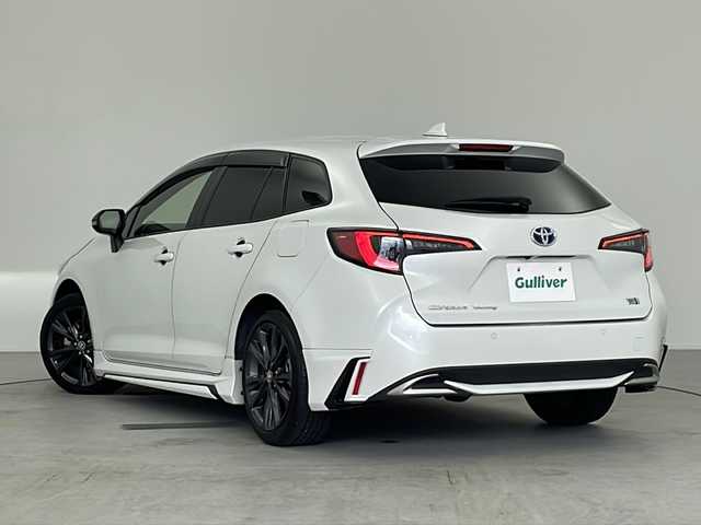 トヨタ カローラツーリング ハイブリッド ダブルバイビー 愛知県 2023(令5)年 7万km プラチナホワイトパールマイカ 禁煙車/純正10.5インチディスプレイオーディオ/(AM/FM/フルセグ)/ブラインドスポットモニター/エアロ(モデリスタ)/バックカメラ/ビルトインＥＴＣ/追従付きクルーズコントロール/純正17インチアルミホイール/ハーフレザーシート/レザーシートカバー/ウィンカー付き電動格納ミラー/ステアリングスイッチ/革巻きステアリング/プッシュスタート/スマートキー/スペアキー/純正フロアマット/純正ドアバイザー/取扱説明書/ナビ取扱説明書
