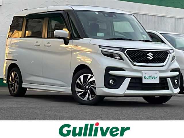 スズキ ソリオ バンディット HV MV 徳島県 2023(令5)年 5.6万km ピュアホワイトP 純正9型ナビ/全方位カメラ/VIEWスイッチ/デュアルブレーキサポートシステム/クルーズコントロール追従有/ヘッドアップディスプレイ/両側パワースライドドア/ドライブレコーダー前後/フルセグTV（走行中視聴可）/コーナーセンサー前後/純正フロアマット/USB入力端子/横滑り防止装置/レーンキープアシスト/盗難防止装置/オートライト/LEDヘッドライト/スマートキー