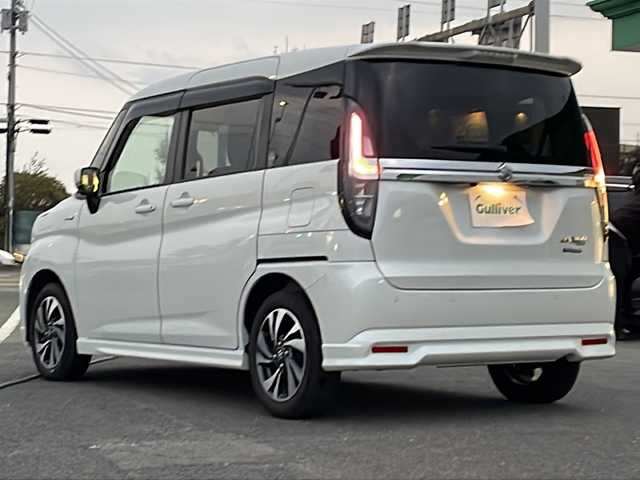 スズキ ソリオ バンディット HV MV 徳島県 2023(令5)年 5.6万km ピュアホワイトP 純正9型ナビ/全方位カメラ/VIEWスイッチ/デュアルブレーキサポートシステム/クルーズコントロール追従有/ヘッドアップディスプレイ/両側パワースライドドア/ドライブレコーダー前後/フルセグTV（走行中視聴可）/コーナーセンサー前後/純正フロアマット/USB入力端子/横滑り防止装置/レーンキープアシスト/盗難防止装置/オートライト/LEDヘッドライト/スマートキー