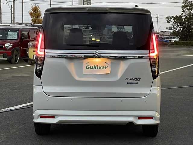 スズキ ソリオ バンディット HV MV 徳島県 2023(令5)年 5.6万km ピュアホワイトP 純正9型ナビ/全方位カメラ/VIEWスイッチ/デュアルブレーキサポートシステム/クルーズコントロール追従有/ヘッドアップディスプレイ/両側パワースライドドア/ドライブレコーダー前後/フルセグTV（走行中視聴可）/コーナーセンサー前後/純正フロアマット/USB入力端子/横滑り防止装置/レーンキープアシスト/盗難防止装置/オートライト/LEDヘッドライト/スマートキー