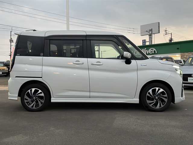 スズキ ソリオ バンディット HV MV 徳島県 2023(令5)年 5.6万km ピュアホワイトP 純正9型ナビ/全方位カメラ/VIEWスイッチ/デュアルブレーキサポートシステム/クルーズコントロール追従有/ヘッドアップディスプレイ/両側パワースライドドア/ドライブレコーダー前後/フルセグTV（走行中視聴可）/コーナーセンサー前後/純正フロアマット/USB入力端子/横滑り防止装置/レーンキープアシスト/盗難防止装置/オートライト/LEDヘッドライト/スマートキー