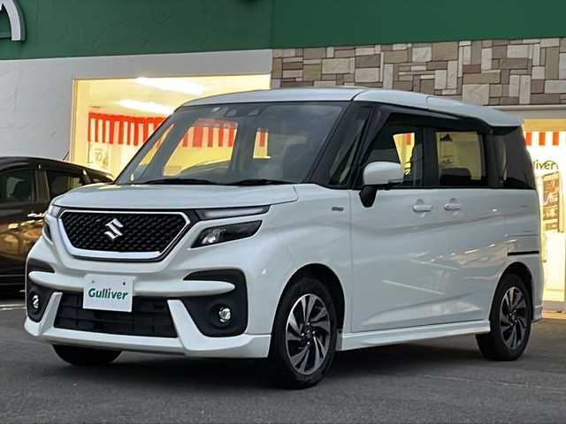 スズキ ソリオ バンディット HV MV 徳島県 2023(令5)年 5.6万km ピュアホワイトP 純正9型ナビ/全方位カメラ/VIEWスイッチ/デュアルブレーキサポートシステム/クルーズコントロール追従有/ヘッドアップディスプレイ/両側パワースライドドア/ドライブレコーダー前後/フルセグTV（走行中視聴可）/コーナーセンサー前後/純正フロアマット/USB入力端子/横滑り防止装置/レーンキープアシスト/盗難防止装置/オートライト/LEDヘッドライト/スマートキー