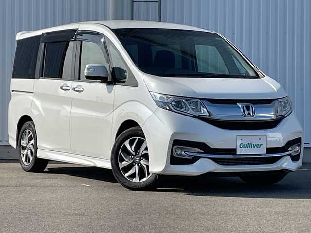 ホンダ ステップワゴン スパーダ ホンダセンシング 愛媛県 2016(平28)年 4.8万km ホワイトオーキッドパール ワンオーナー/純正9インチナビ/（フルセグ/AM/FM/Bluetooth/DVD)/ホンダセンシング/・衝突軽減ブレーキ/・誤発進抑制機能/・車線維持支援システム/・オートクルーズコントロール/両側パワースライドドア/バックカメラ/ETC/パドルシフト/オートライト/純正16インチアルミホイール/純正フロアマット/スマートキー×２