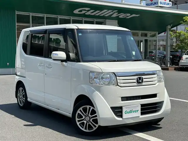 ホンダ Ｎ ＢＯＸ G Lパッケージ 島根県 2015(平27)年 6.5万km プレミアムホワイトパール 社外メモリナビ（AVIC-RZ05)/ワンセグテレビ・Bluetoothオーディオ・CD・DVD/バックカメラ/アイドリングストップ/横滑り防止装置/ウィンカーミラー/ドアバイザー/スマートキー/プッシュスタート/片側パワースライドドア/ETC/純正１４インチアルミホイール/社外フロアマット/スペアキー/スタッドレスタイヤ（積込）