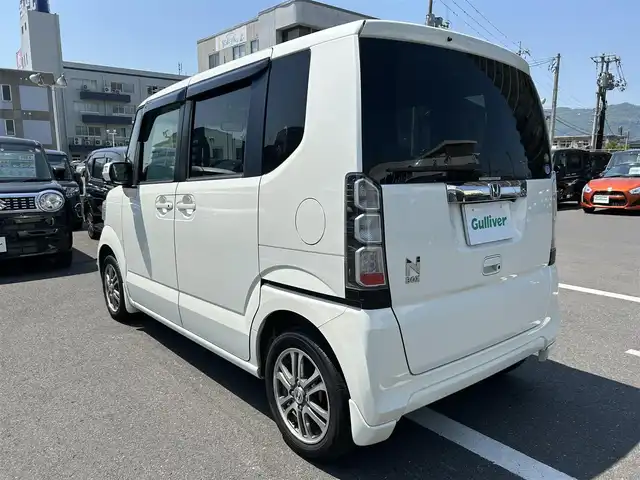 ホンダ Ｎ ＢＯＸ G Lパッケージ 島根県 2015(平27)年 6.5万km プレミアムホワイトパール 社外メモリナビ（AVIC-RZ05)/ワンセグテレビ・Bluetoothオーディオ・CD・DVD/バックカメラ/アイドリングストップ/横滑り防止装置/ウィンカーミラー/ドアバイザー/スマートキー/プッシュスタート/片側パワースライドドア/ETC/純正１４インチアルミホイール/社外フロアマット/スペアキー/スタッドレスタイヤ（積込）