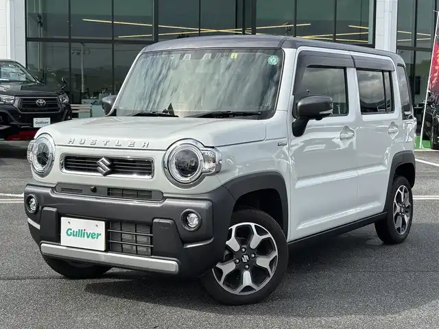 スズキ ハスラー HYBRID X 奈良県 2023(令5)年 0.6万km ピュアホワイトパール/ガンメタリック2トーン 純正9インチナビ(フルセグTV/CD/DVD/AM・FM/BT/AppleCarPlay/AndroidAuto)/アラウンドビューモニター/ビルトインETC/前後ドラレコ/シートヒーター(D/N席)/クルーズコントロール/デュアルカメラブレーキサポート/後退時ブレーキサポート/誤発進抑制機能/車線逸脱抑制機能/先行車発進お知らせ機能/ふらつき警報機能/アイドリングストップ機能/360°プレミアムUV＆IRカットガラス/ナノイーX搭載フルオートエアコン/LEDヘッドライト/純正15インチアルミホイール/純正フロアマット/スペアキー/保証書/取扱説明書