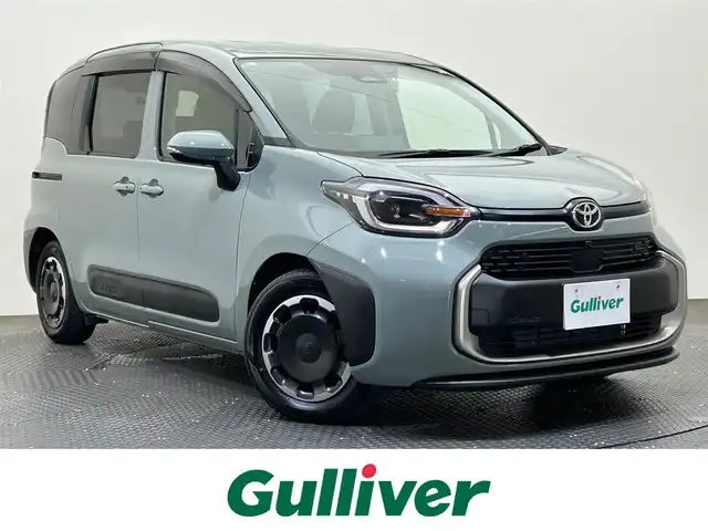 トヨタ シエンタ ハイブリッド Z 愛媛県 2023(令5)年 0.8万km アーバンカーキ ・１０．５型ナビ/（フルセグＴＶ・ＢＴ・ＦＭ・ＡＭ・ＵＳＢ・ＣＤ・ＤＶＤ）/・全方位カメラ　/・前後ドラレコ　/・ＥＴＣ　/・両側パワースライドドア　/・衝突軽減ブレーキ　/・レーンキープアシスト　/・レーダークルーズコントロール/・100V充電