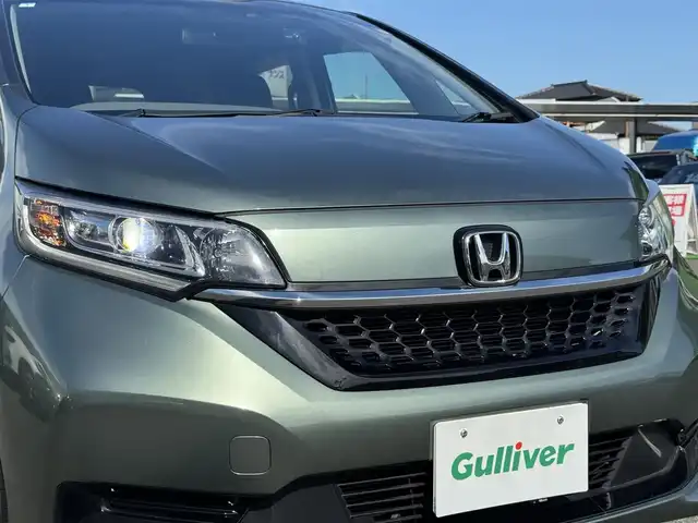 ホンダ フリード＋ G ホンダセンシング 千葉県 2021(令3)年 2.7万km シルバーミストグリーンM ワンオーナー/ホンダセンシング/・衝突被害軽減ブレーキ/・誤発進抑制機能/・車線逸脱防止支援システム/・アダプティブクルーズコントロール/コーナーセンサー/カーテンエアバッグ/LEDヘッドライト/純正9インチメモリナビ/Bluetooth/CD＆DVD再生/バックカメラ/フルセグTV/AM・FMラジオ/ETC/前後ドライブレコーダー/両側パワースライドドア/純正フロアマット/ハーフレザーシート/D＋N席シートヒーター/革巻きステアリング/純正15インチアルミホイール/ドアバイザー/プッシュスタート/スマートキー/スペアキー/取扱説明書＆保証書/R7年記録簿