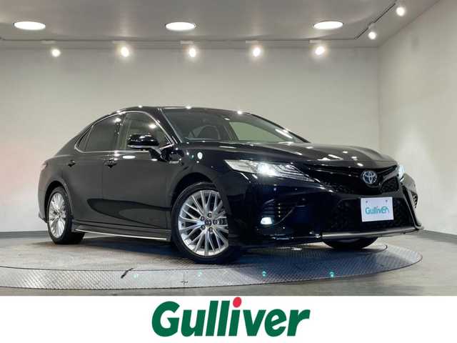 トヨタ カムリ WSレザーパッケージ 愛知県 2018(平30)年 5.8万km アティチュードブラックマイカ 純正8インチナビ/JBLサウンド/衝突軽減ブレーキ/レーダークルーズコントロール/100V電源/ビルトインETC2.0/シートヒーター/LEDヘッドライト/バックカメラ/ドライブレコーダー/ワイヤレス充電/ブラインドスポットモニター/前席パワーシート/フルセグTV/Bluetooth/コーナーセンサー/レーンキープアシスト/オートハイビーム/プッシュスタート/USB接続/スマートキー/CD/DVD再生/ミュージックサーバー/ミュージックプレイヤー接続/フロアマット/純正アルミホイール/オートライト/本革シート/ヘッドアップディスプレイ/禁煙車/パドルシフト/電動格納ミラー/フォグランプ/ステアリングリモコン/横滑り防止装置/寒冷地仕様/リヤクロストラフィックアラート/インテリジェントクリアランスソナー/電動パーキングブレーキ/オートブレーキホールド