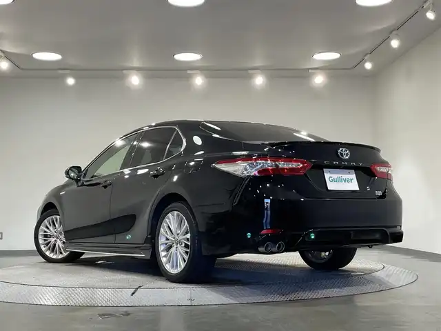 トヨタ カムリ WSレザーパッケージ 愛知県 2018(平30)年 5.8万km アティチュードブラックマイカ 純正8インチナビ/JBLサウンド/衝突軽減ブレーキ/レーダークルーズコントロール/100V電源/ビルトインETC2.0/シートヒーター/LEDヘッドライト/バックカメラ/ドライブレコーダー/ワイヤレス充電/ブラインドスポットモニター/前席パワーシート/フルセグTV/Bluetooth/コーナーセンサー/レーンキープアシスト/オートハイビーム/プッシュスタート/USB接続/スマートキー/CD/DVD再生/ミュージックサーバー/ミュージックプレイヤー接続/フロアマット/純正アルミホイール/オートライト/本革シート/ヘッドアップディスプレイ/禁煙車/パドルシフト/電動格納ミラー/フォグランプ/ステアリングリモコン/横滑り防止装置/寒冷地仕様/リヤクロストラフィックアラート/インテリジェントクリアランスソナー/電動パーキングブレーキ/オートブレーキホールド