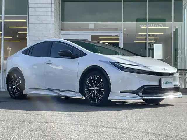 トヨタ プリウス Z 兵庫県 2023(令5)年 2.1万km プラチナホワイトパールマイカ 純正12.3インチナビ/モデリスタフルエアロ/アラウンドビューモニター/パノラマルーフ/ステアリングヒーター/レーダークルーズコントロール/革巻きステアリング/シートヒーター/エアーシート/ワイヤレス充電/トヨタチームメイト/シートメモリ/フルセグTV/純正フロアマット/純正19インチアルミホイール
