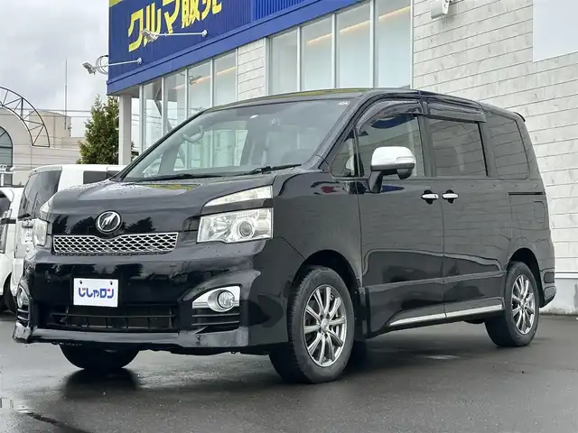 トヨタ ヴォクシー ZS 煌Ⅱ 道北・旭川 2012(平24)年 10.5万km ブラック (株)IDOMが運営する【じしゃロン旭川店】の自社ローン専用車両になります。こちらは現金またはオートローンご利用時の価格です。自社ローンご希望の方は別途その旨お申付け下さい/　/・社外ナビ(CD/DVD/BT/HDD/SD/フルセグ)/・ETC/・ドライブレコーダー/・バックカメラ/・ステアリングリモコン/・両側パワースライドドア/・フリップダウン/・純正AWサマータイヤ積込 205/60R16/・取扱説明書